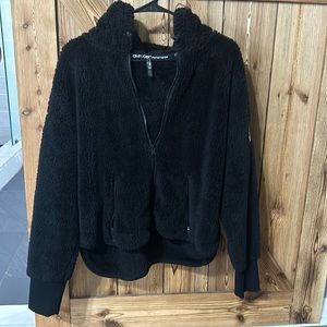 Never worn, hooded, Calvin Klein performance jacket, zip up and zip up pockets
